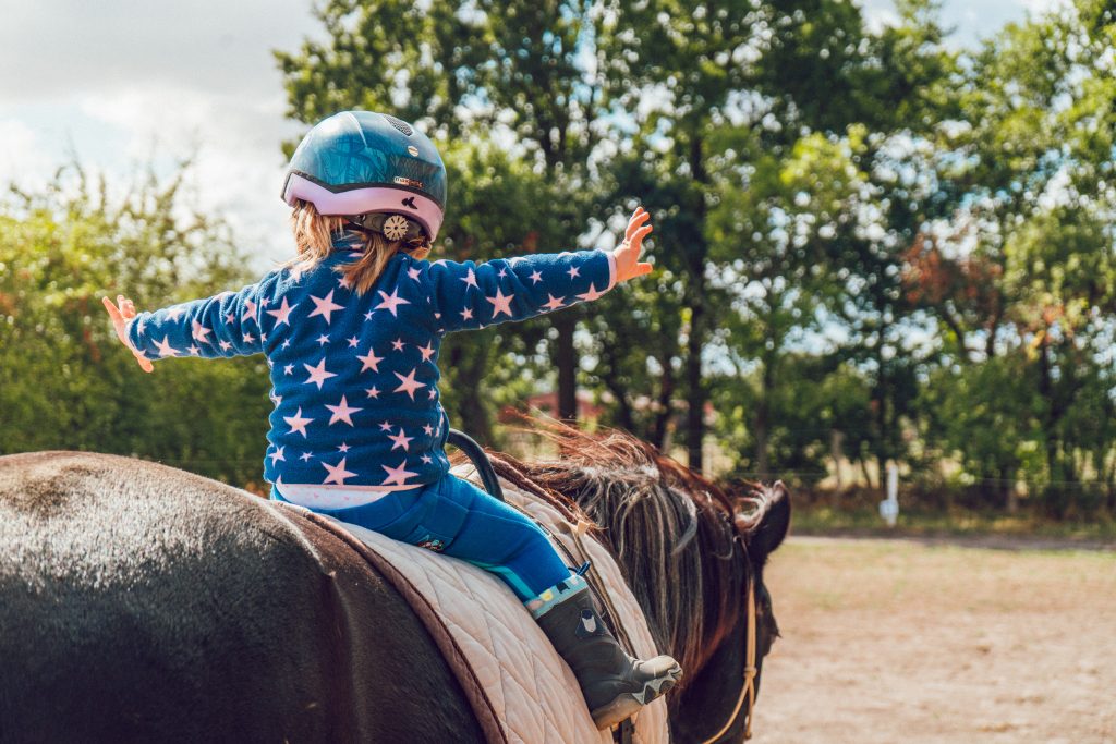 A child sitting on a horse